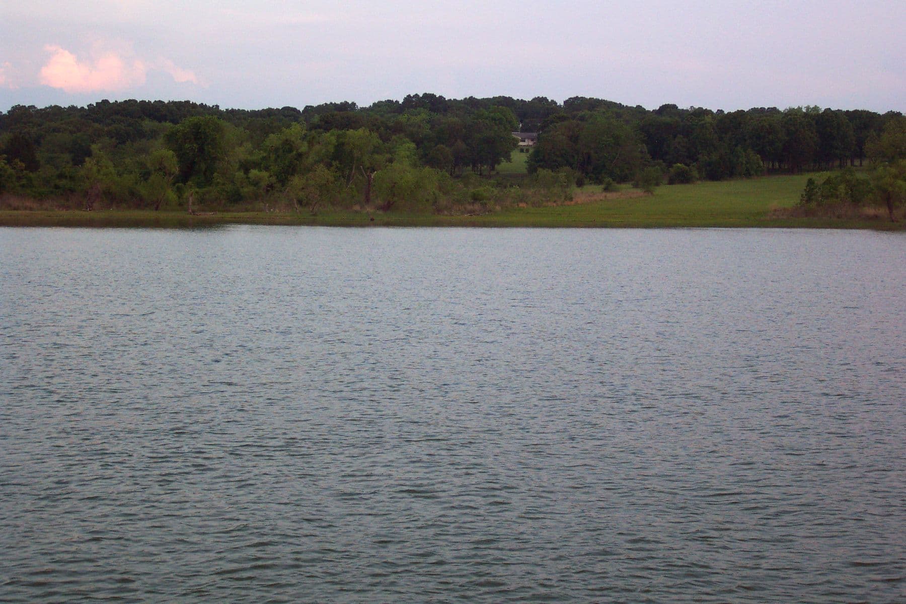 Calm open water and a tree-lined shore at Lake Texoma